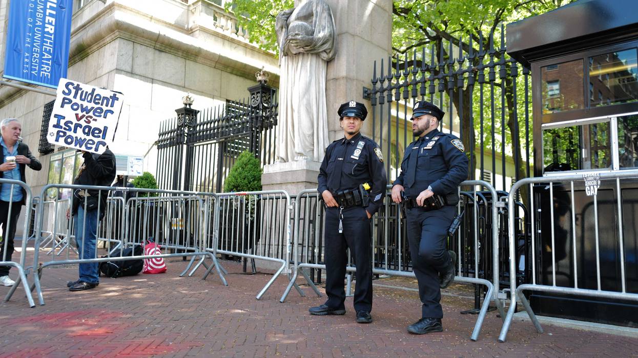 NYPD officers stand at the entrance of Columbia University on May 1, 2024
