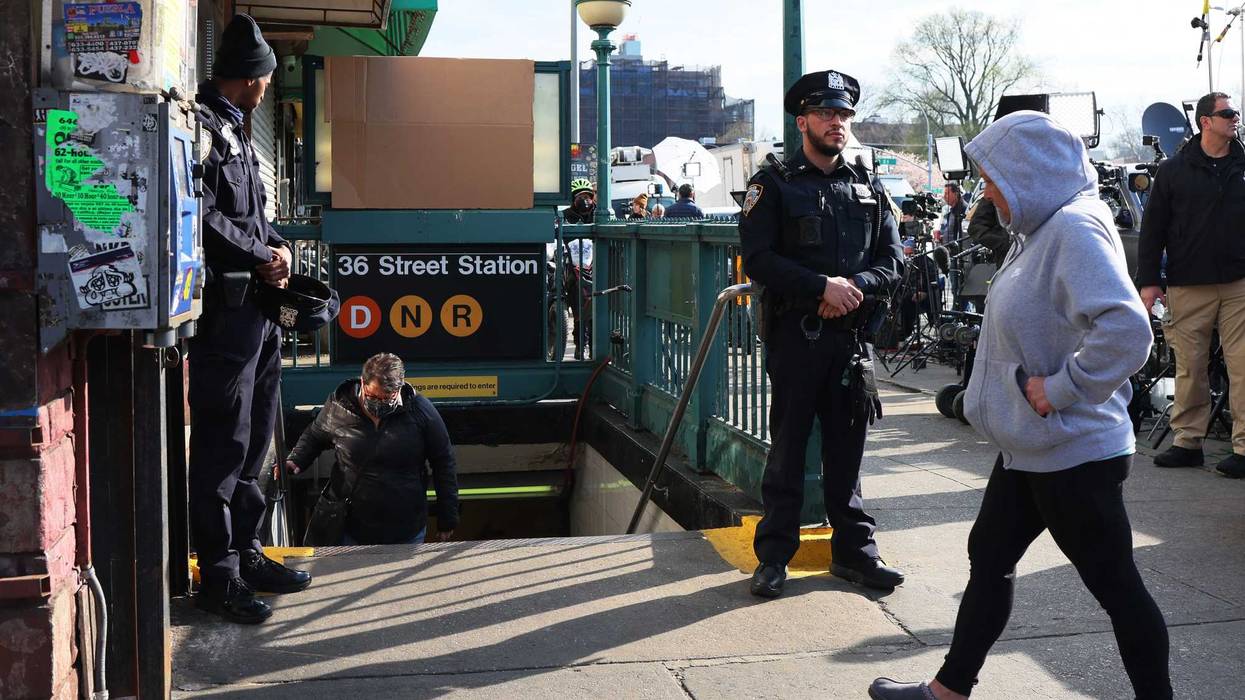 NYPD officers stand guard at the 36th Street subway station on April 13, 2022 in the Sunset Park neighborhood of Brooklyn