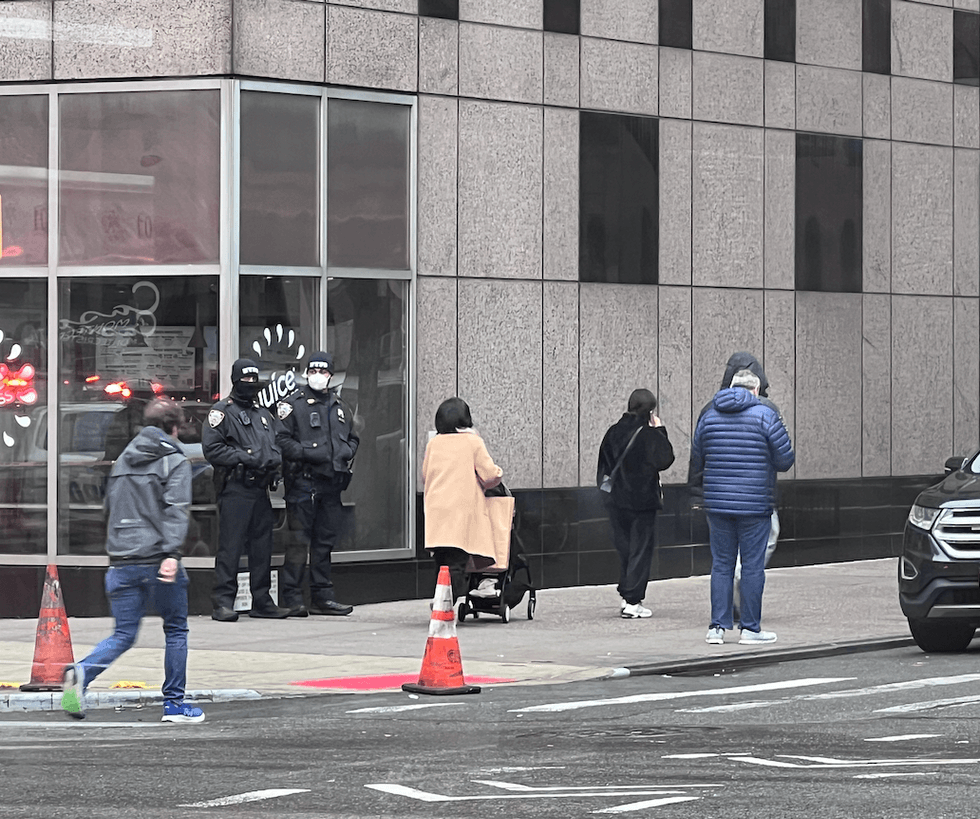 NYPD officers were seen masked near the scene of the steam line rupture due to potential asbestos