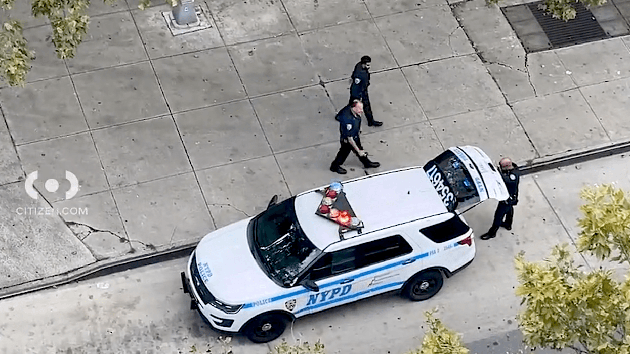NYPD officers were seen outside the Lafayette Gardens Houses after the shooting Monday evening