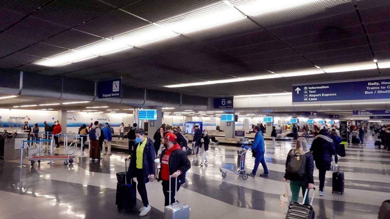 O'Hare travelers collect their luggage at baggage claim
