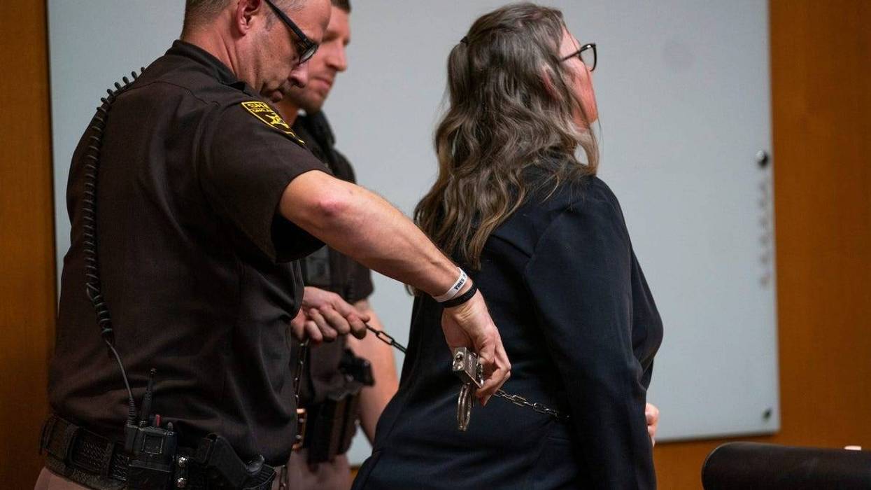 Oakland County Sheriff deputies use a belly chain transport handcuffs on Jennifer Crumbley during a recess during day three of her trial on Monday, Jan. 29, 2024.