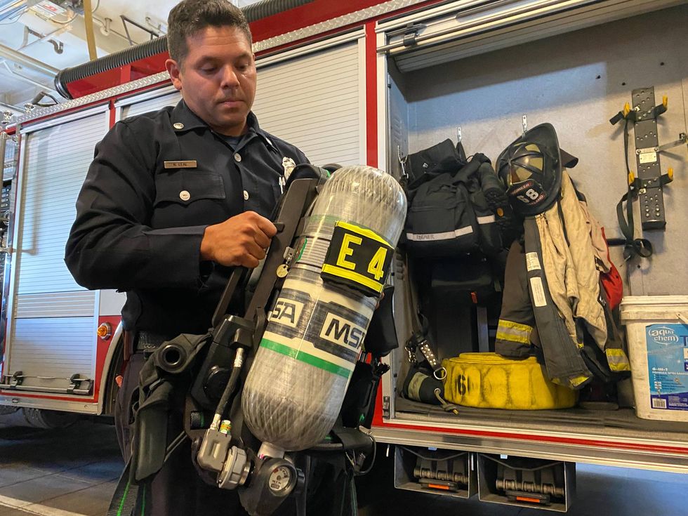 Oakland Fire Department Lt. Nathan Leal shows off one of the department