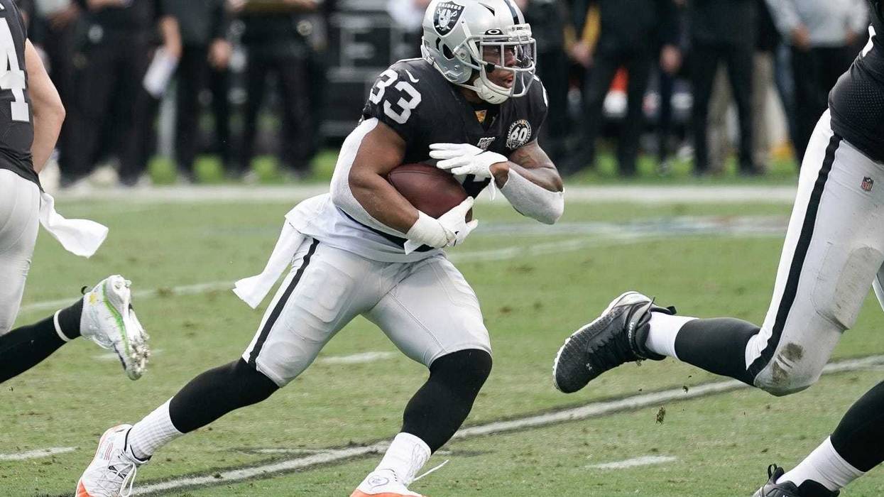 Oakland Raiders running back DeAndre Washington (33) runs with the football against the Tennessee Titans during the first quarter at Oakland Coliseum. Stan Szeto-USA TODAY Sports