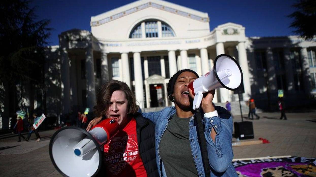 Oakland Unified School District teachers use bullhorns as they picket outside of Oakland Technical High School on February 21, 2019 in Oakland, California.
