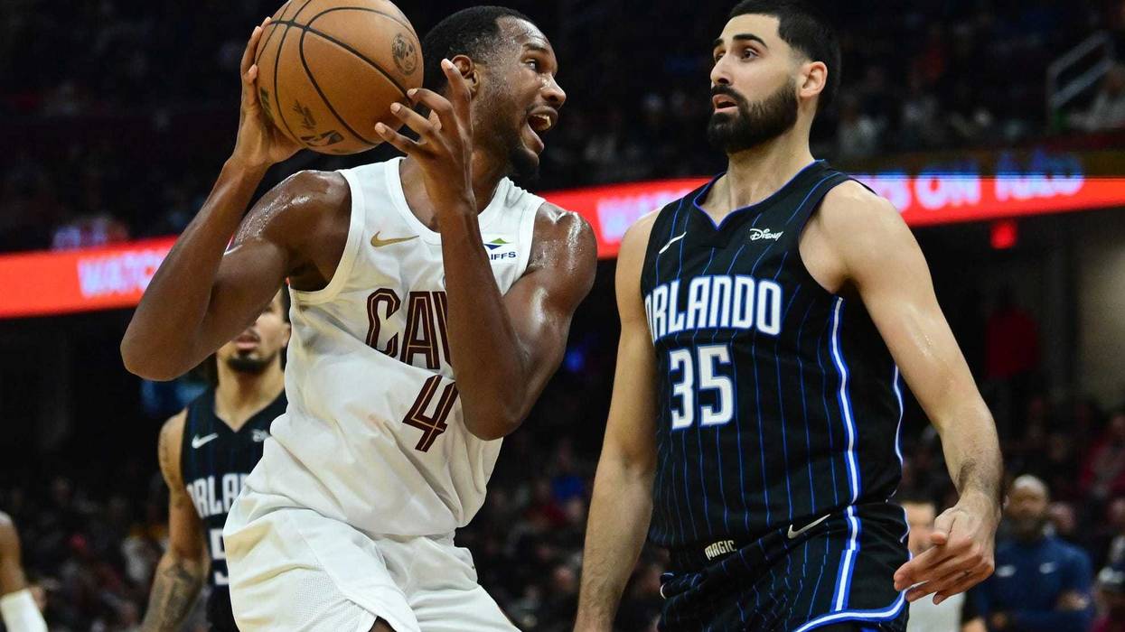 Oct 12, 2023; Cleveland, Ohio, USA; Cleveland Cavaliers forward Evan Mobley (4) drives to the basket against Orlando Magic center Goga Bitadze (35) during the second half at Rocket Mortgage FieldHouse. Mandatory Credit: Ken Blaze-USA TODAY Sports