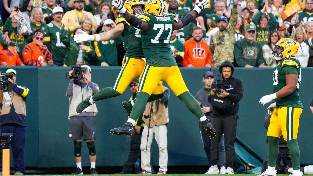 Oct 12, 2025; Green Bay, Wisconsin, USA; Green Bay Packers tight end Tucker Kraft (85) celebrates with tackle Jordan Morgan (77) after scoring a touchdown in the fourth quarter at Lambeau Field. Mandatory Credit: Jeff Hanisch-Imagn Images