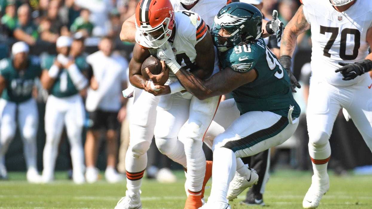 Oct 13, 2024; Philadelphia, Pennsylvania, USA; Philadelphia Eagles defensive tackle Jalen Carter (98) sacks Cleveland Browns quarterback Deshaun Watson (4) during the second quarter at Lincoln Financial Field.