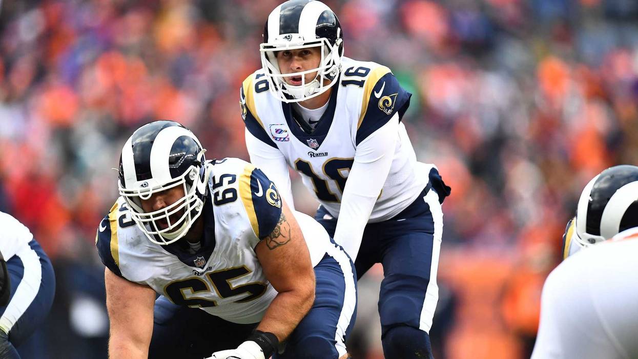 Oct 14, 2018; Denver, CO, USA; Los Angeles Rams quarterback Jared Goff (16) calls for the snap from center John Sullivan (65) in the second half against the Denver Broncos at Broncos Stadium at Mile High. Mandatory Credit: Ron Chenoy-USA TODAY Sports