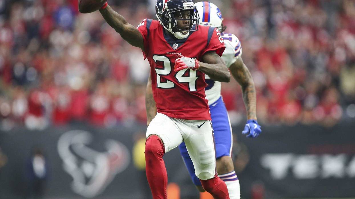 Oct 14, 2018; Houston, TX, USA; Houston Texans cornerback Johnathan Joseph (24) returns an interception for a touchdown against Buffalo Bills wide receiver Kelvin Benjamin (13) during the fourth quarter at NRG Stadium. Mandatory Credit: Troy Taormina-USA