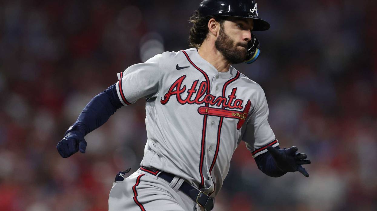 Oct 14, 2022; Philadelphia, Pennsylvania, USA; Atlanta Braves shortstop Dansby Swanson hits a double against the Philadelphia Phillies during the 6th inning in game three of the NLDS for the 2022 MLB Playoffs at Citizens Bank Park.