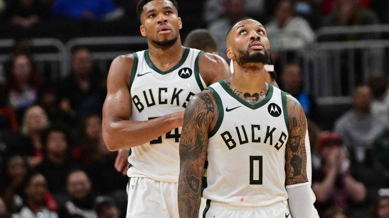 Oct 14, 2024; Milwaukee, Wisconsin, USA; Milwaukee Bucks forward Giannis Antetokounmpo (34) and guard Damian Lillard (0) look on in the second quarter against the Chicago Bulls at Fiserv Forum. Mandatory Credit: Benny Sieu-Imagn Images