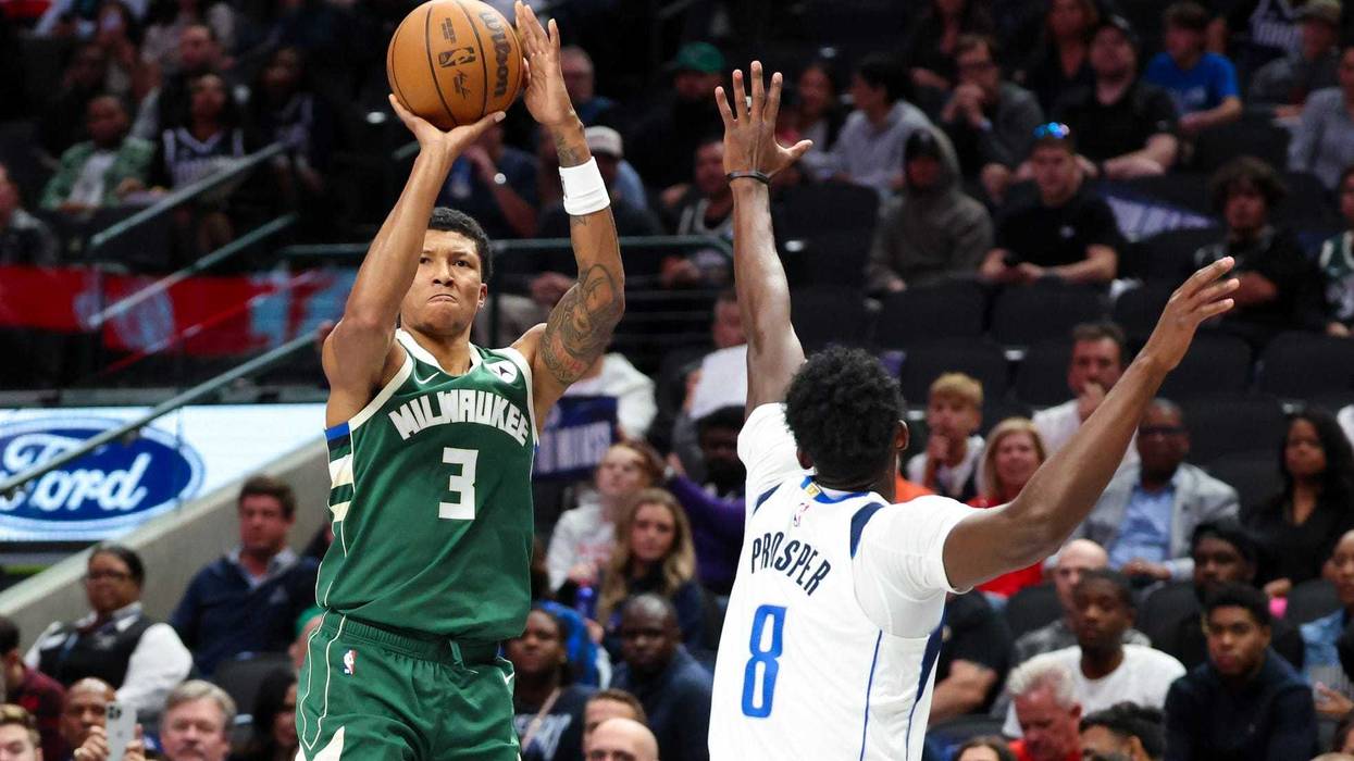 Oct 17, 2024; Dallas, Texas, USA; Milwaukee Bucks forward MarJon Beauchamp (3) shoots as Dallas Mavericks forward Olivier-Maxence Prosper (8) defends during the second half at American Airlines Center