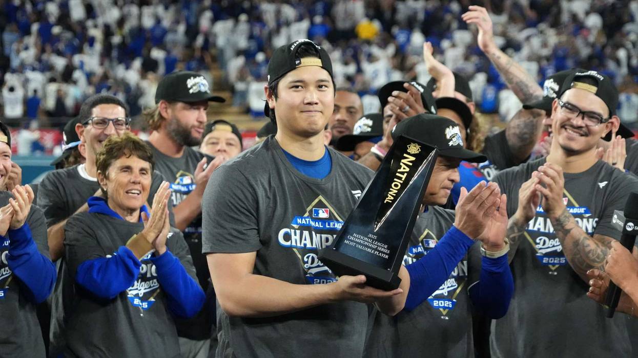 Oct 17, 2025; Los Angeles, California, USA; Los Angeles Dodgers two-way player Shohei Ohtani (17) holds the NLCS most valuable player trophy after game four of the NLCS round for the 2025 MLB playoffs against the Milwaukee Brewers at Dodger Stadium.