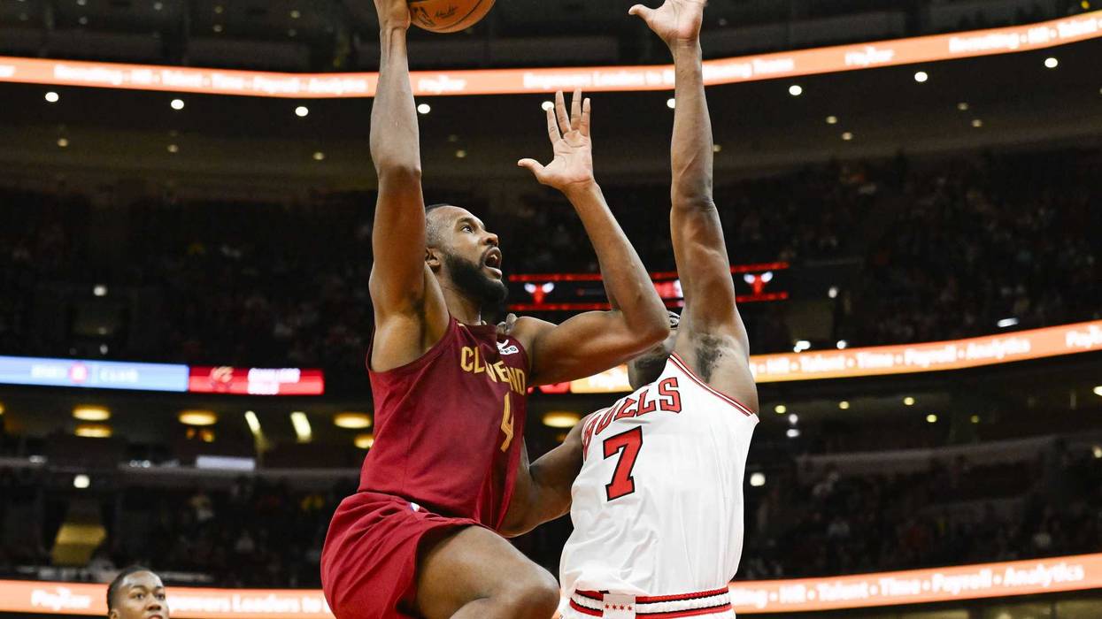 Oct 18, 2024; Chicago, Illinois, USA; Cleveland Cavaliers forward Evan Mobley (4) drives to the basket against Chicago Bulls guard Jalen Smith (7) during the second half at the United Center.