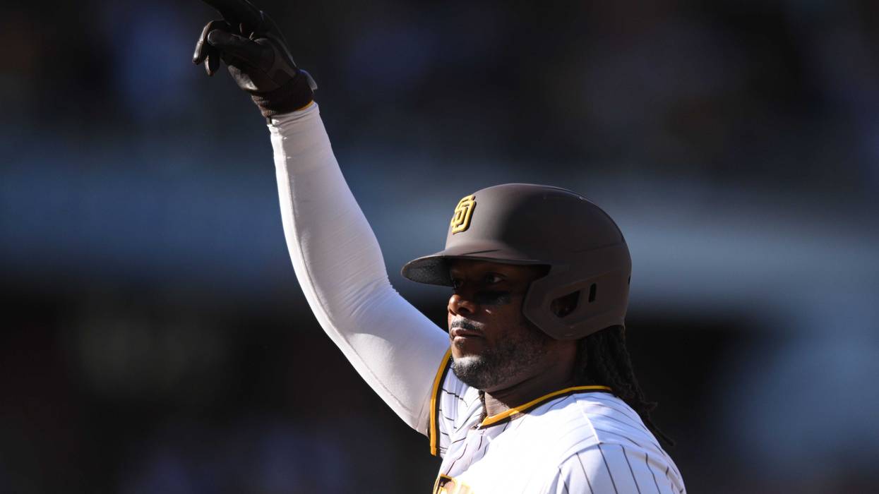 Oct 19, 2022; San Diego, California, USA; San Diego Padres designated hitter Josh Bell (24) celebrates an RBI-single in the fifth inning against the Philadelphia Phillies during game two of the NLCS for the 2022 MLB Playoffs at Petco Park.