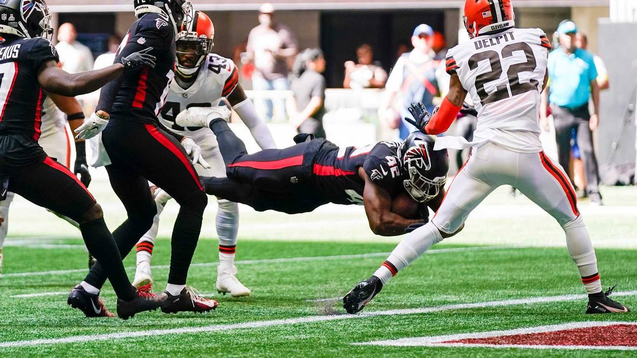 Oct 2, 2022; Atlanta, Georgia, USA; Atlanta Falcons running back Caleb Huntley (42) scores a touchdown against the Cleveland Browns during the second half at Mercedes-Benz Stadium.