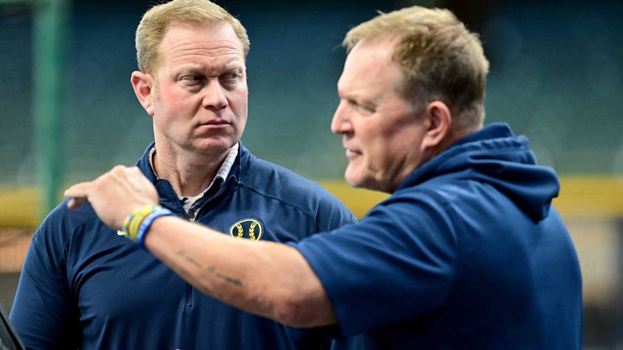 Oct 2, 2024; Milwaukee, Wisconsin, USA; Milwaukee Brewers general manager Matt Arnold talks to manager Matt Arnold before game two of the Wildcard round for the 2024 MLB Playoffs against the New York Mets at American Family Field. Mandatory Credit: Benny Sieu-Imagn Images