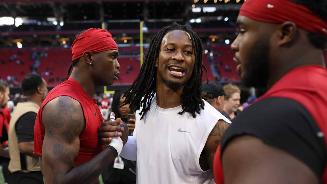 Oct 20, 2019; Atlanta, GA, USA; Los Angeles Rams running back Todd Gurley (center) greets Atlanta Falcons wide receiver Julio Jones (left) and defensive tackle Grady Jarrett (right) after their game at Mercedes-Benz Stadium. Mandatory Credit: Jason Getz-U