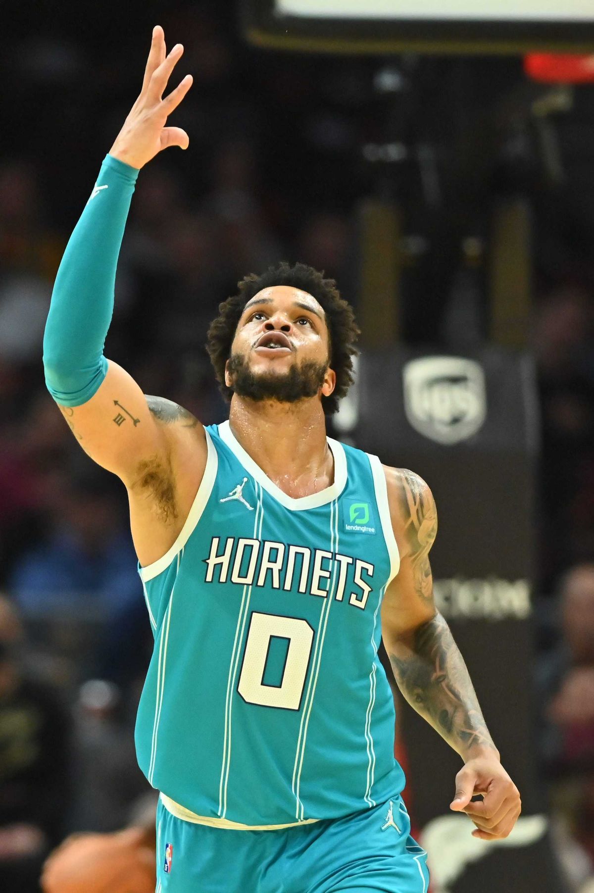 Oct 22, 2021; Cleveland, Ohio, USA; Charlotte Hornets forward Miles Bridges (0) celebrates a three point shot during the second half against the Cleveland Cavaliers at Rocket Mortgage FieldHouse.