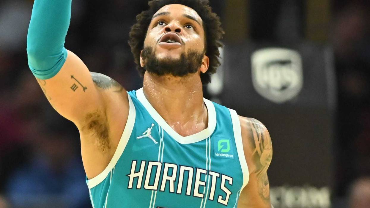 Oct 22, 2021; Cleveland, Ohio, USA; Charlotte Hornets forward Miles Bridges (0) celebrates a three point shot during the second half against the Cleveland Cavaliers at Rocket Mortgage FieldHouse.