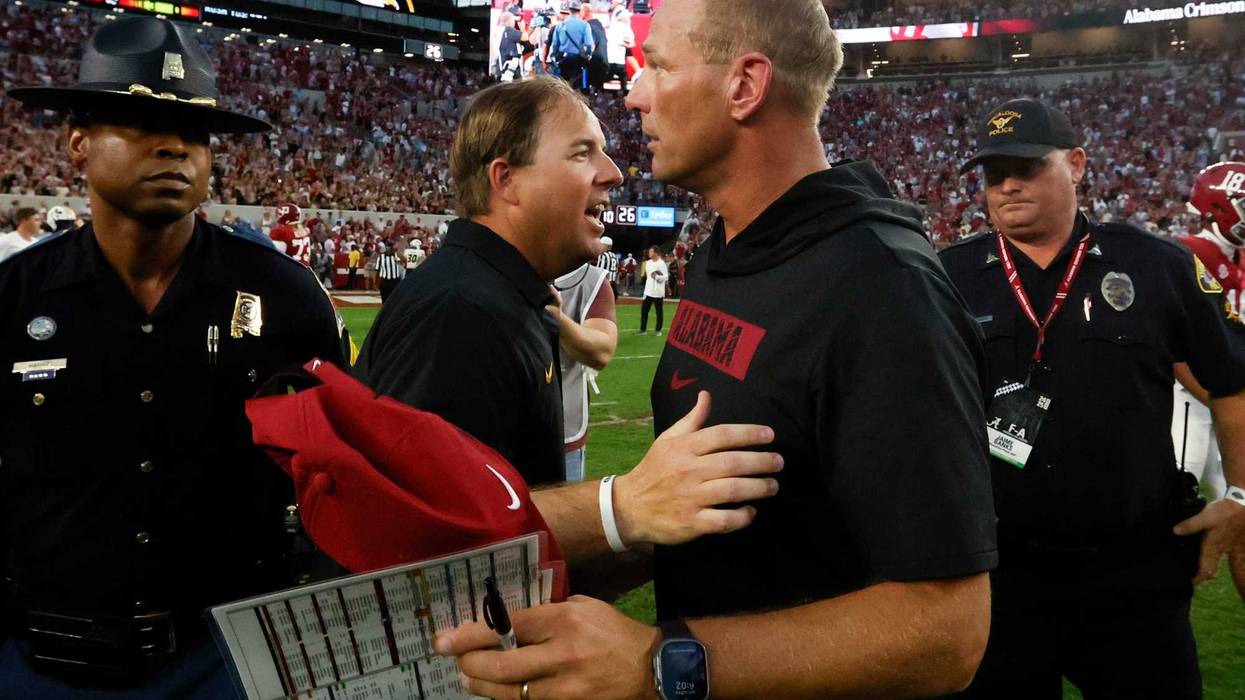 Oct 26, 2024; Tuscaloosa, Alabama, USA; Missouri Tigers head coach Eliah Drinkwitz (left) talks with Alabama Crimson Tide head coach Kalen DeBoer (right) after a game at Bryant-Denny Stadium. Mandatory Credit: Butch Dill-Imagn Images