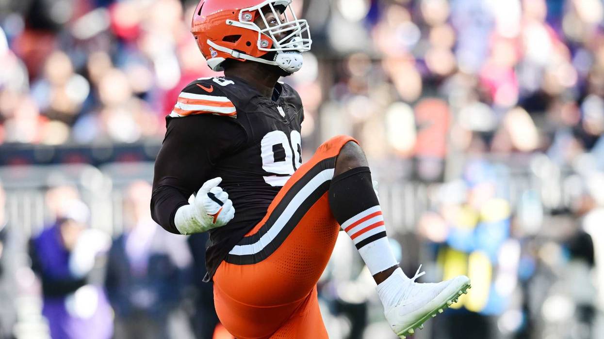 Oct 27, 2024; Cleveland, Ohio, USA; Cleveland Browns defensive end Za'Darius Smith (99) celebrates after sacking Baltimore Ravens quarterback Lamar Jackson (8) during the second half at Huntington Bank Field.
