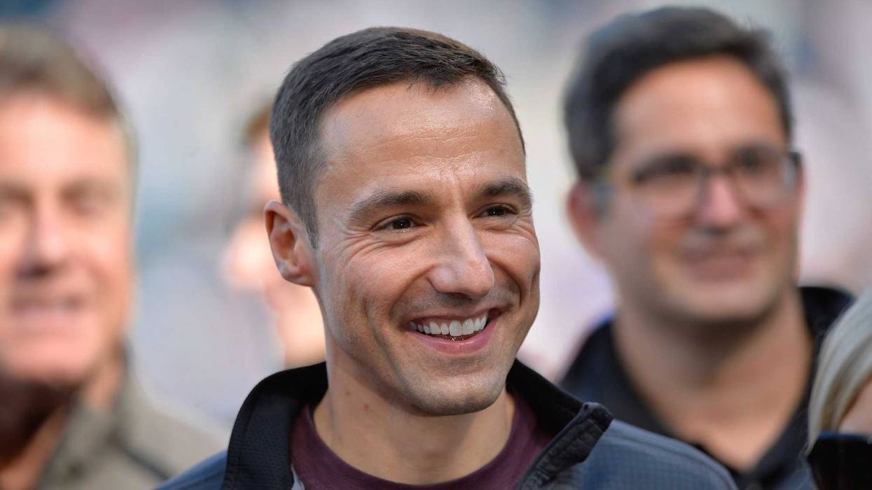 Oct 4, 2015; Cleveland, OH, USA; Cleveland Indians general manager Chris Antonetti stands on the field prior to a game between the Cleveland Indians and the Boston Red Sox at Progressive Field. Cleveland won 3-1. Mandatory Credit: David Richard-USA TODAY