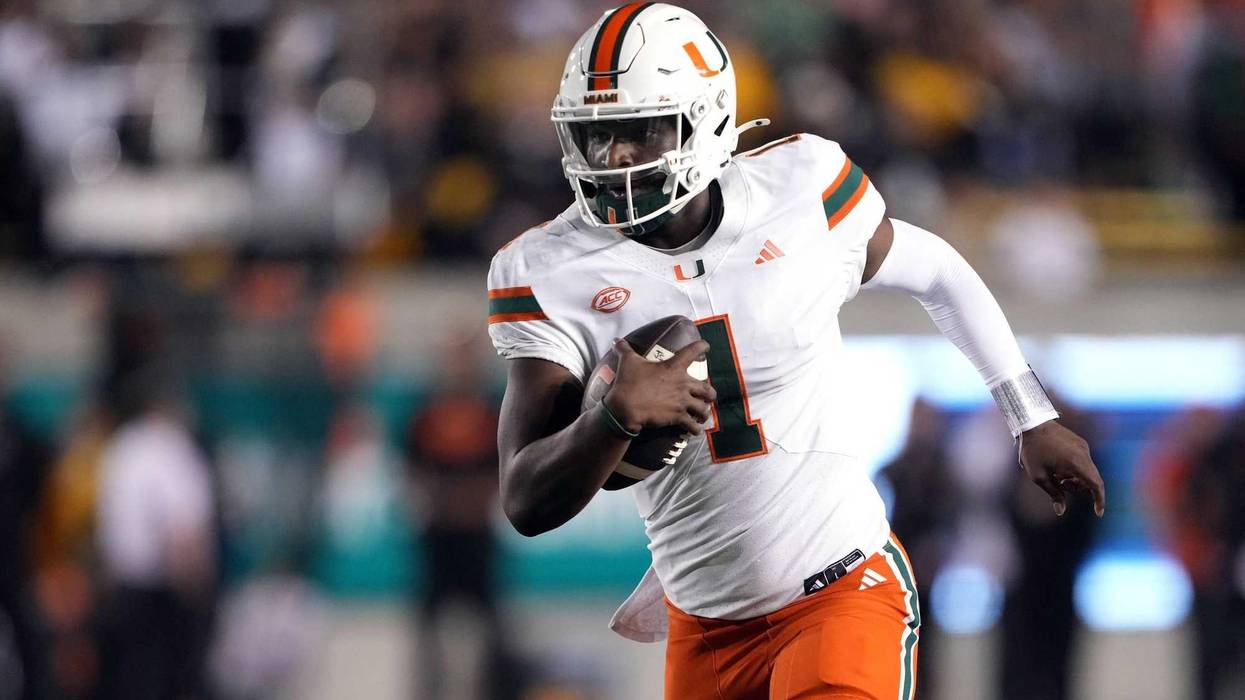 Oct 5, 2024; Berkeley, California, USA; Miami Hurricanes quarterback Cam Ward (1) rushes for a touchdown /across the/ during the fourth quarter at California Memorial Stadium.