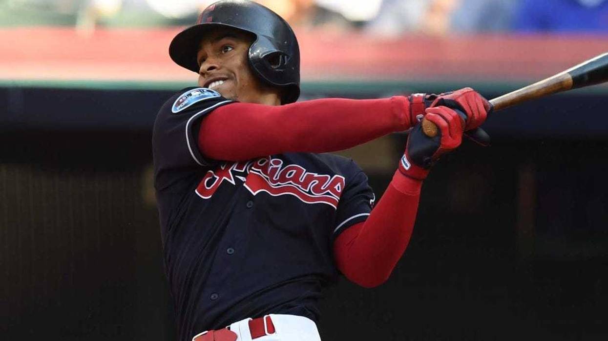 Oct 8, 2018; Cleveland, OH, USA;Cleveland Indians shortstop Francisco Lindor (12) hits a solo home run in the fifth inning against the Houston Astros during game three of the 2018 ALDS playoff baseball series at Progressive Field. Mandatory Credit: Ken Bl