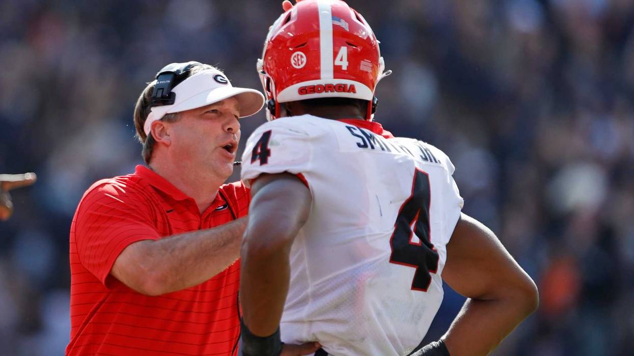 Oct 9, 2021; Auburn, Alabama, USA; Georgia Bulldogs head coach Kirby Smart talks to Georgia Bulldogs linebacker Nolan Smith (4) during the first quarter against the Auburn Tigers at Jordan-Hare Stadium.