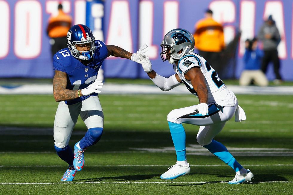 Odell Beckham doing battle with Panthers cornerback Josh Norman