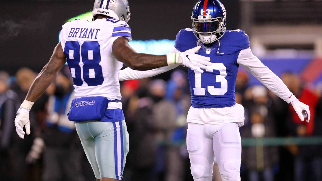 Odell Beckham Jr. greets Dallas Cowboys wide receiver Dez Bryant during warmups before a game at MetLife Stadium