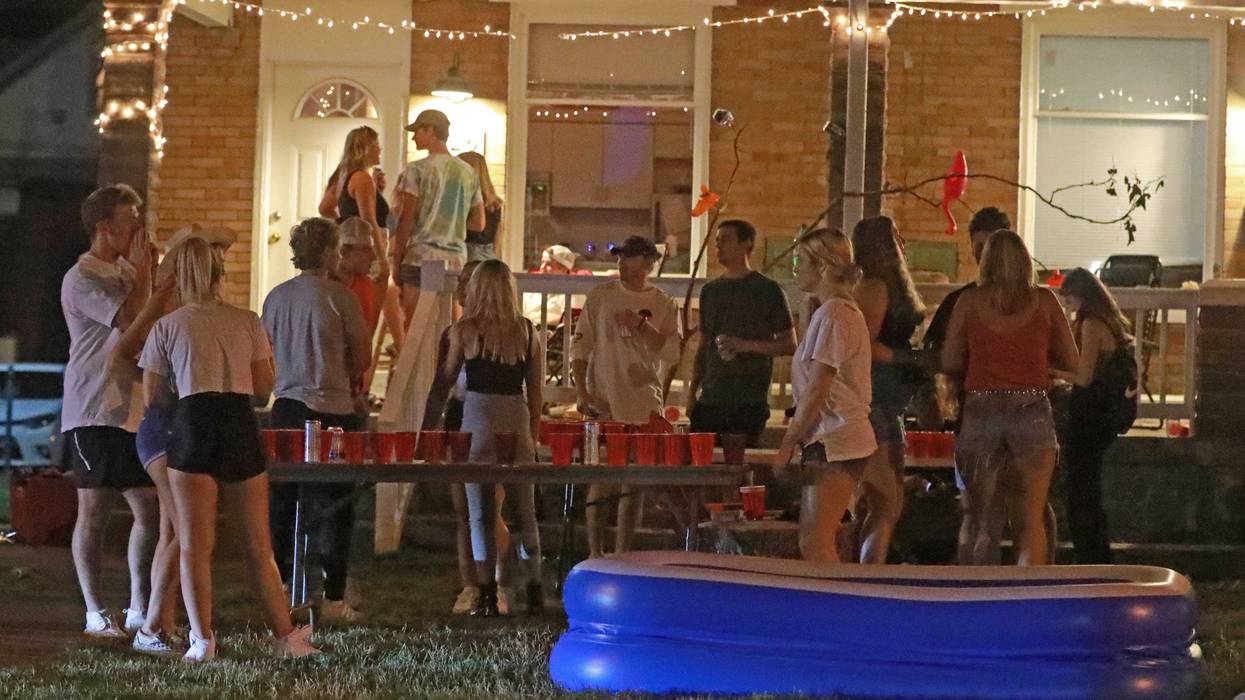 Off-campus porch and yard parties near the Ohio State University campus in Columbus were packed Thursday, August 20, 2020. Few masks were visible even though the COVID-19 pandemic is rampant. A mix of online and in-person classes begin August 25, 2020 at