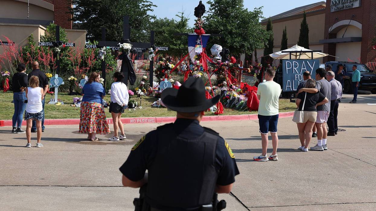officer looks at memorial