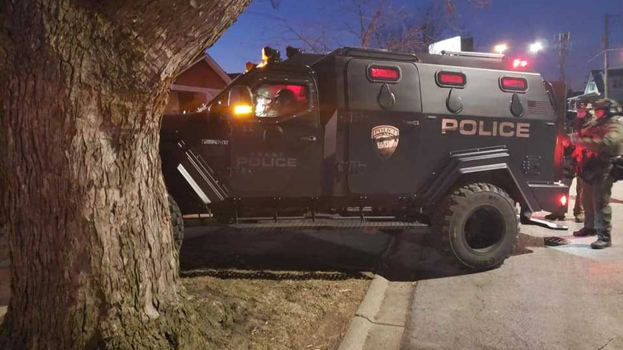 Officers from the Posen Police Department conduct search warrant of suspect's home who threatened police on social media