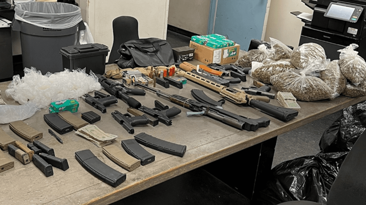Officers recovered thousands of dollars in drugs and firearms in the bust on Wednesday.