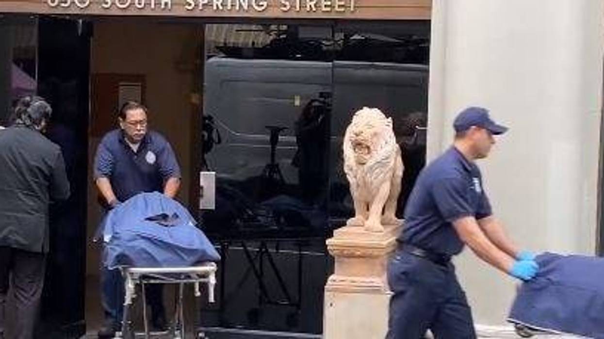 officers rolling out body bags