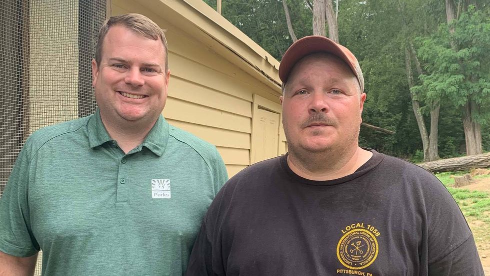 Official farmer of the Allegheny County Parks system, Chris Roland, and the caretaker of the buffalo, Bob Kuzma