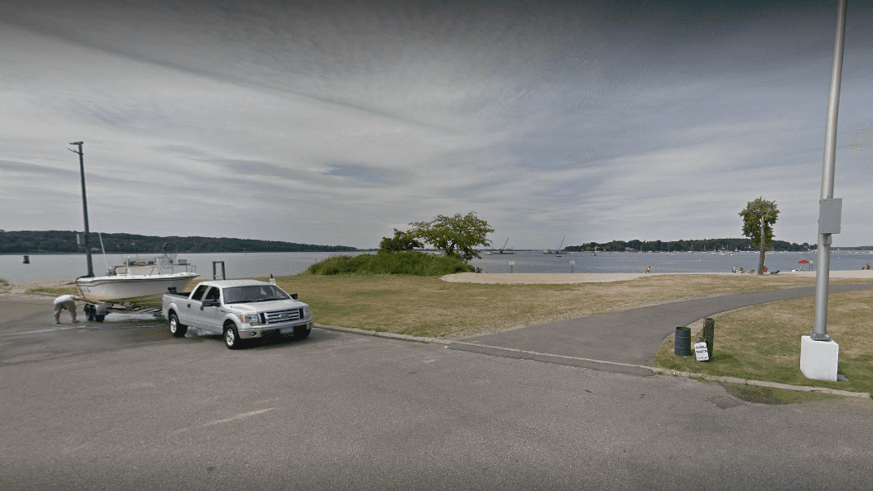 Officials are investigating after a man was found dead inside a submerged car at a Long Island marina Thursday morning.
