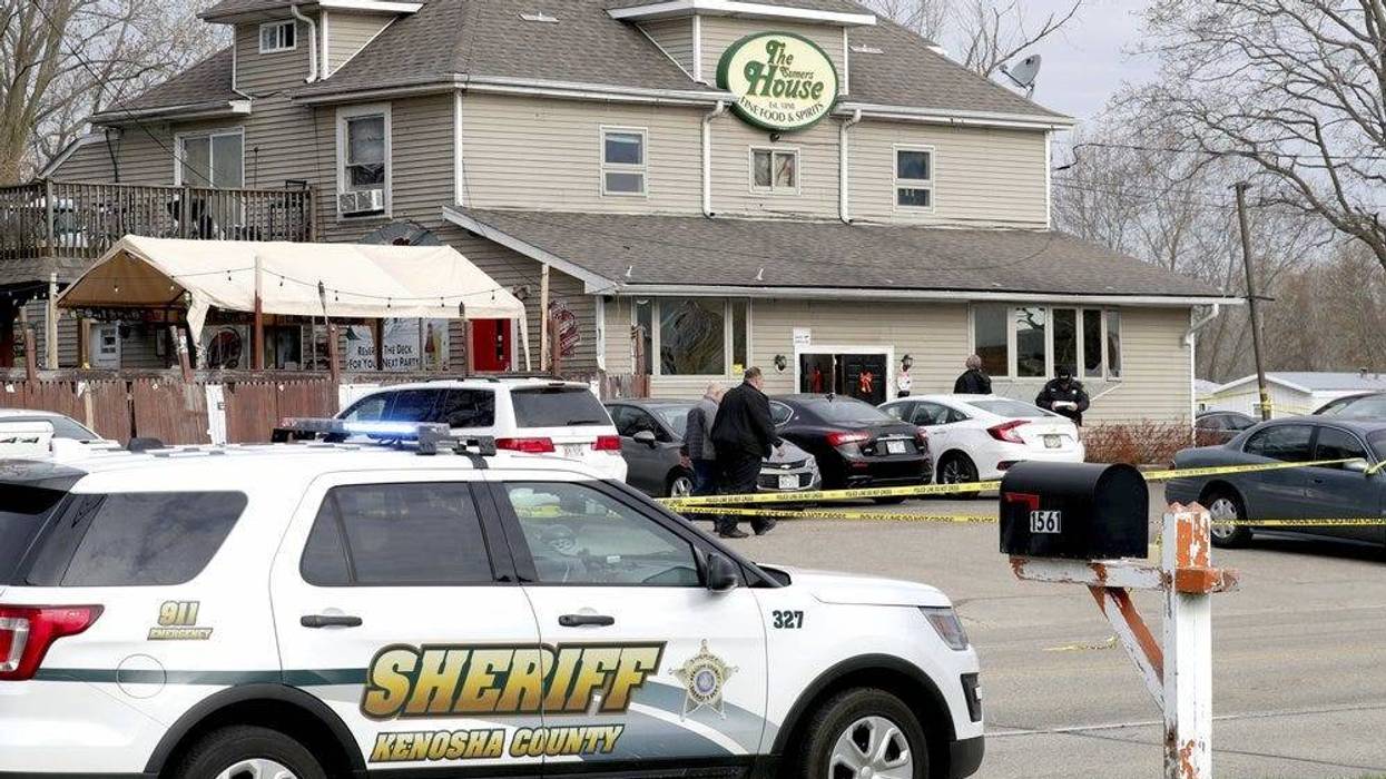 Officials investigate the scene a deadly shooting at Somers House Tavern in Kenosha, Wis., Sunday, April 18, 2021. Several people were killed and two were seriously wounded in a shooting at the busy tavern in southeastern Wisconsin early Sunday, sheriff's officials said.