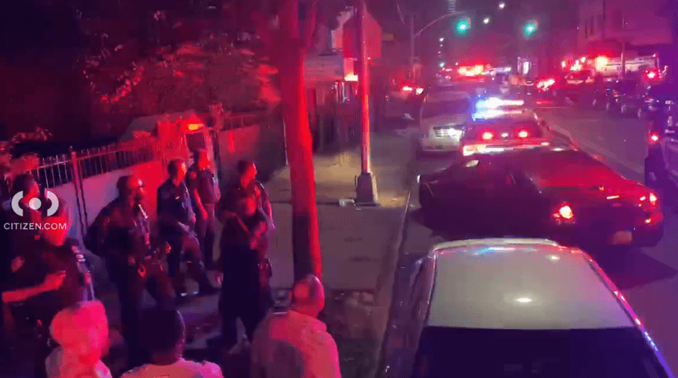 Officials respond on Saturday night after a police car crash in Brooklyn sends two officers to the hospital.