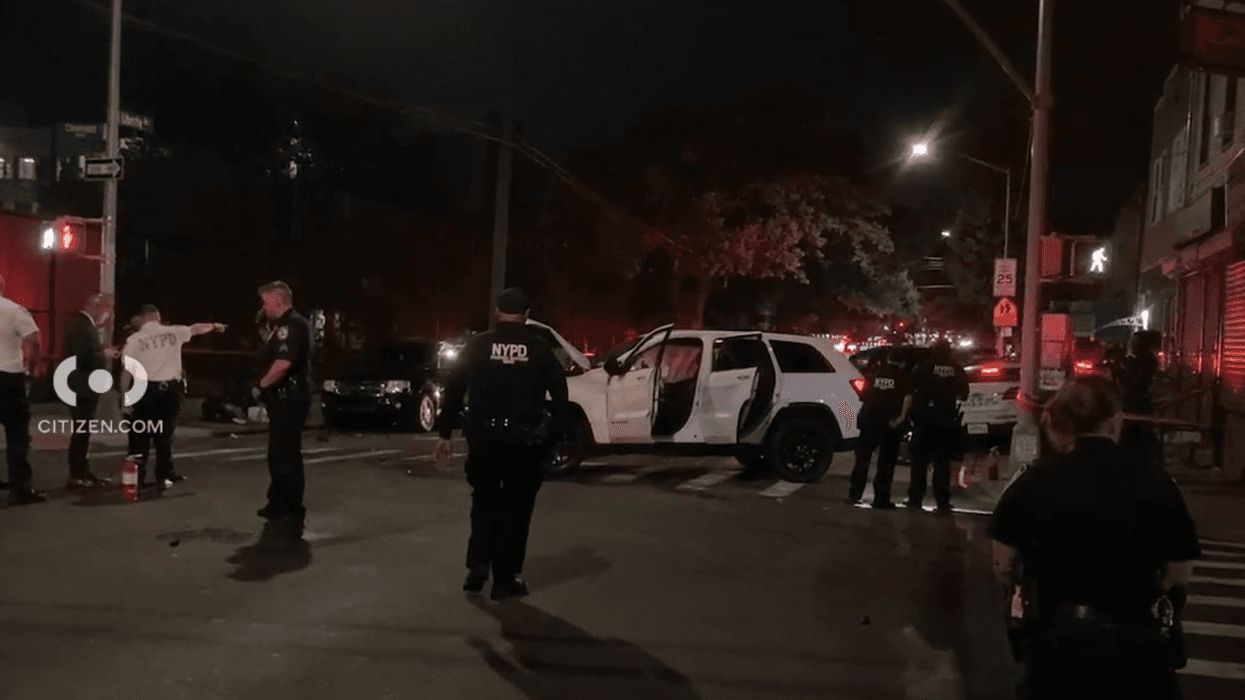 Officials respond on Saturday night after a police car crash in Brooklyn sends two officers to the hospital.