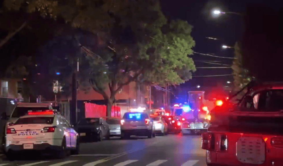 Officials respond on Saturday night after a police car crash in Brooklyn sends two officers to the hospital.