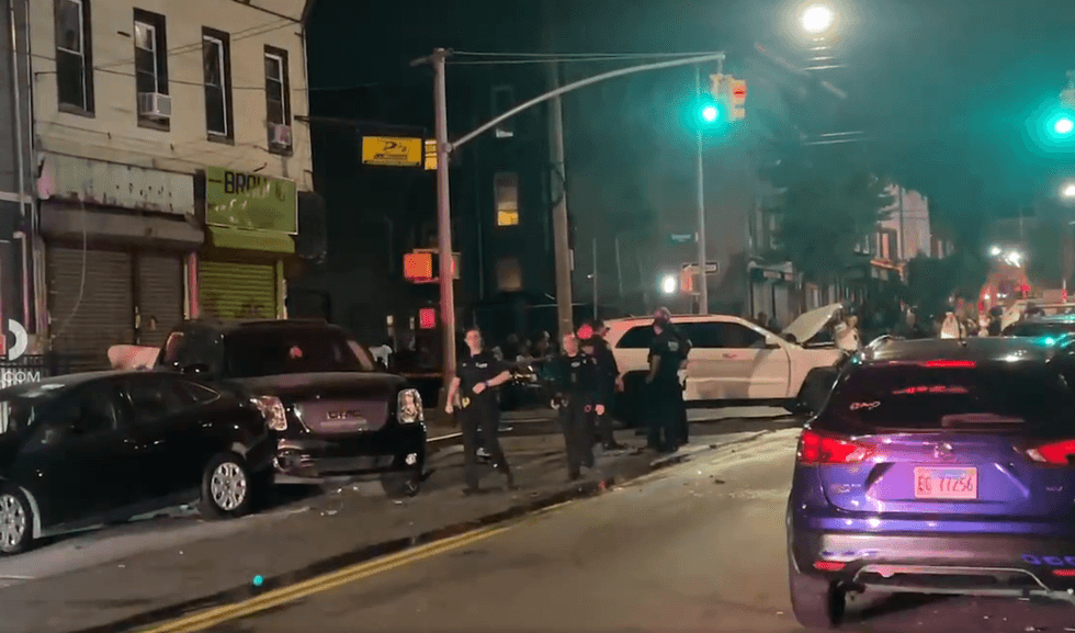 Officials respond on Saturday night after a police car crash in Brooklyn sends two officers to the hospital.