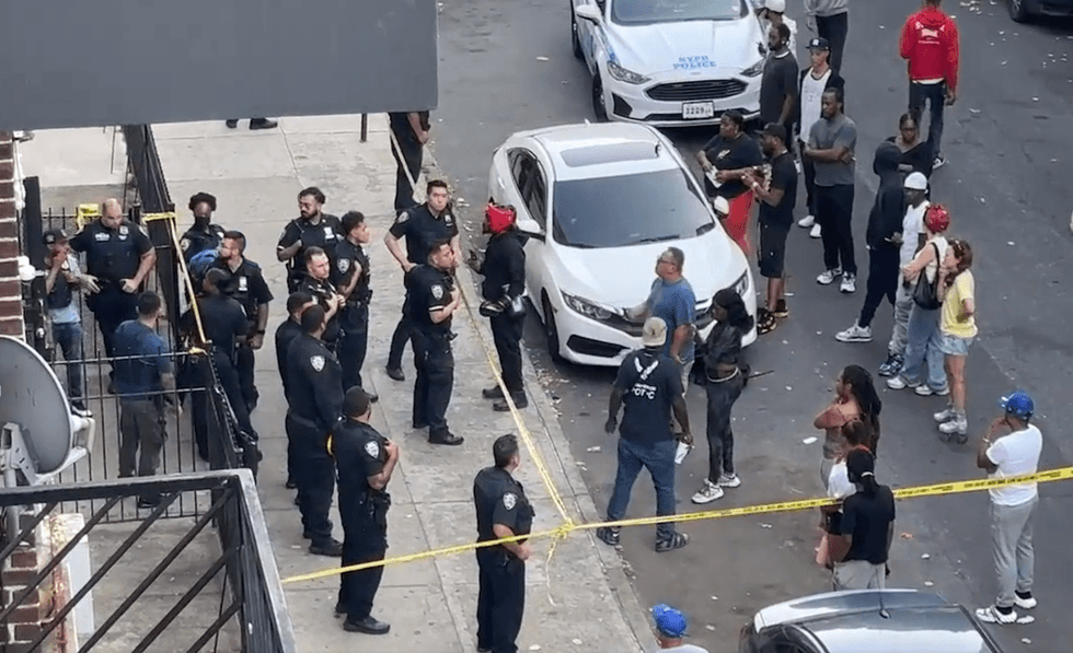 Officials respond to a police-involved shooting that occurred inside a Flatbush, Brooklyn apartment building on Friday.