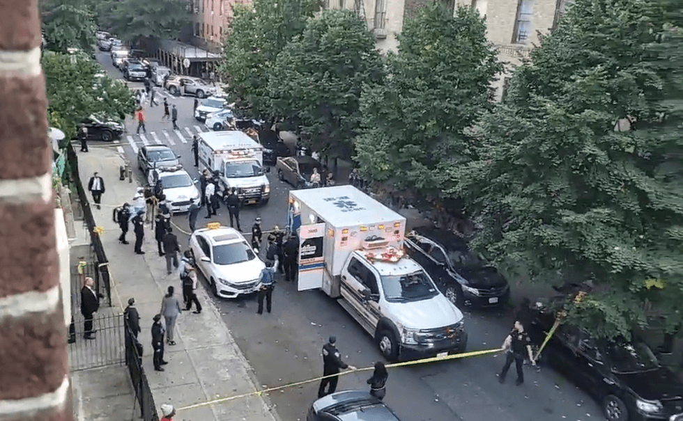 Officials respond to a police-involved shooting that occurred inside a Flatbush, Brooklyn apartment building on Friday.