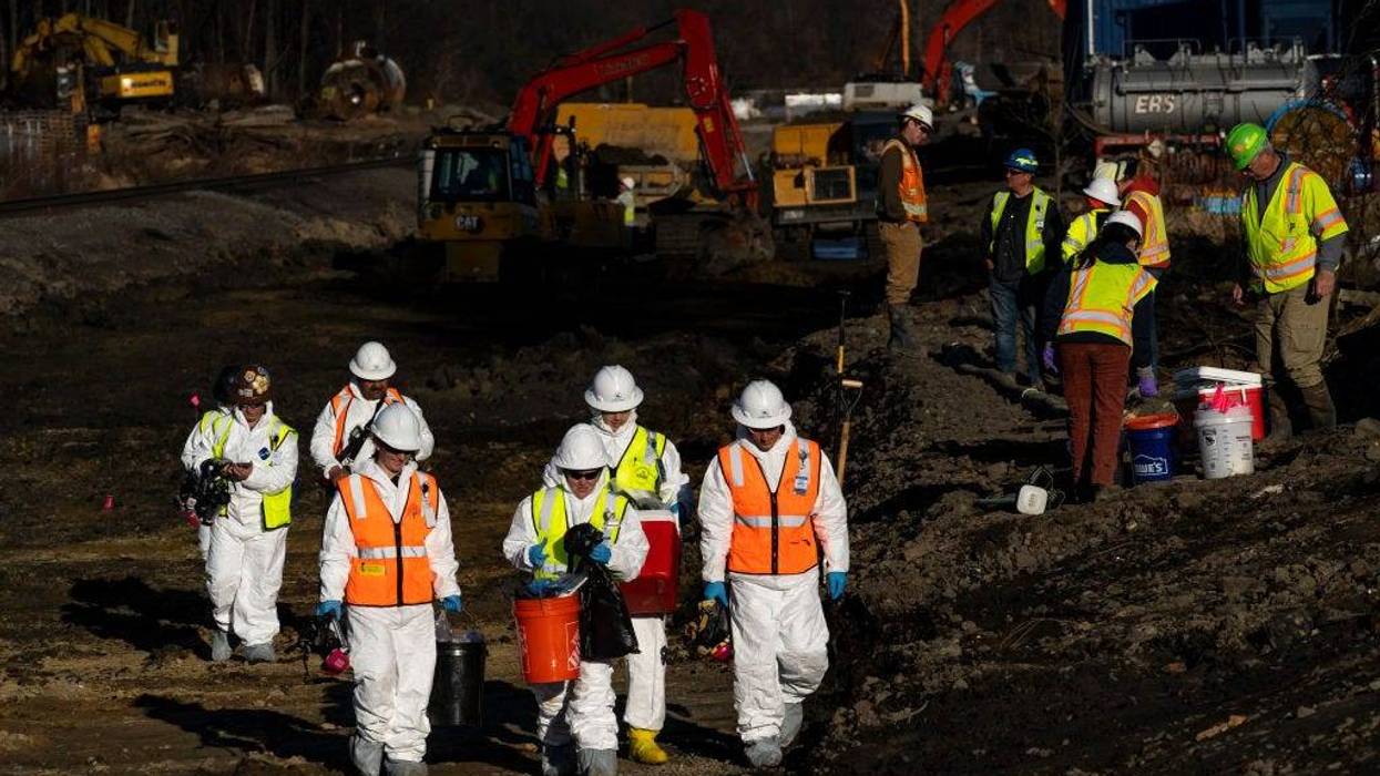 Ohio EPA and EPA contractors collect soil and air samples from the derailment site