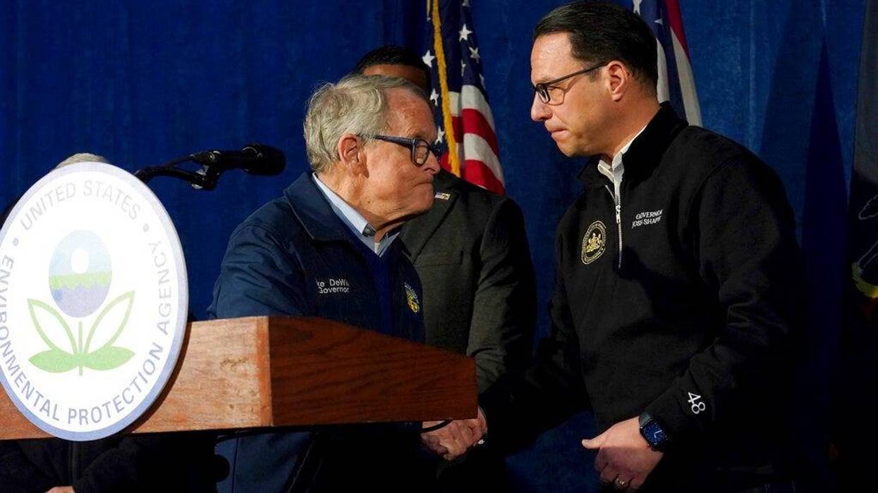 Ohio Gov. Mike DeWine greets Pennsylvania Gov. Josh Shapiro during a news conference in East Palestine, Ohio, Tuesday, Feb. 21, 2023.