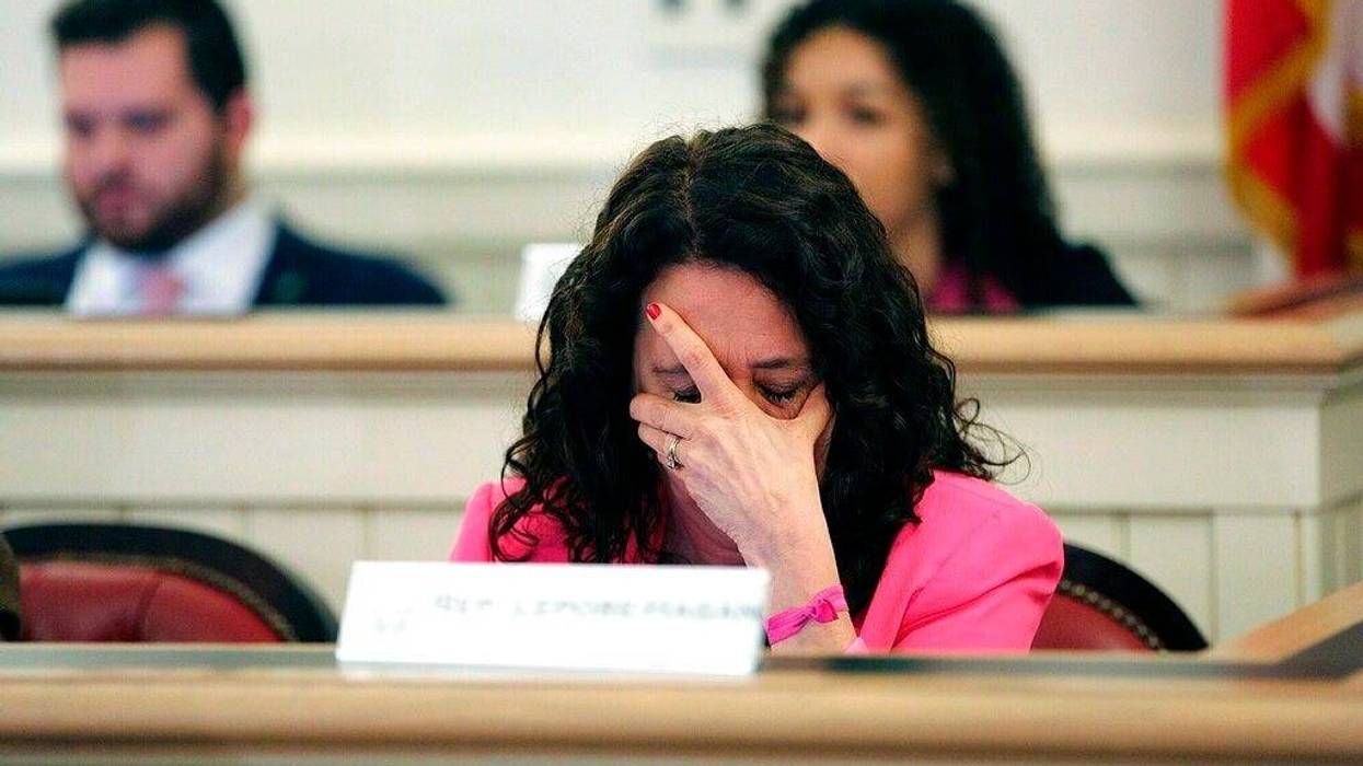 Ohio Representative Michele Lepore-Hagan wipes tears from her face during a hearing to propose amendments to the "Heartbeat Bill" which was later voted to pass through the committee and to the House floor at the Ohio Statehouse in Columbus, Ohio on Tuesda